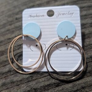 gold-toned drop hoop earrings with light blue circle studs,